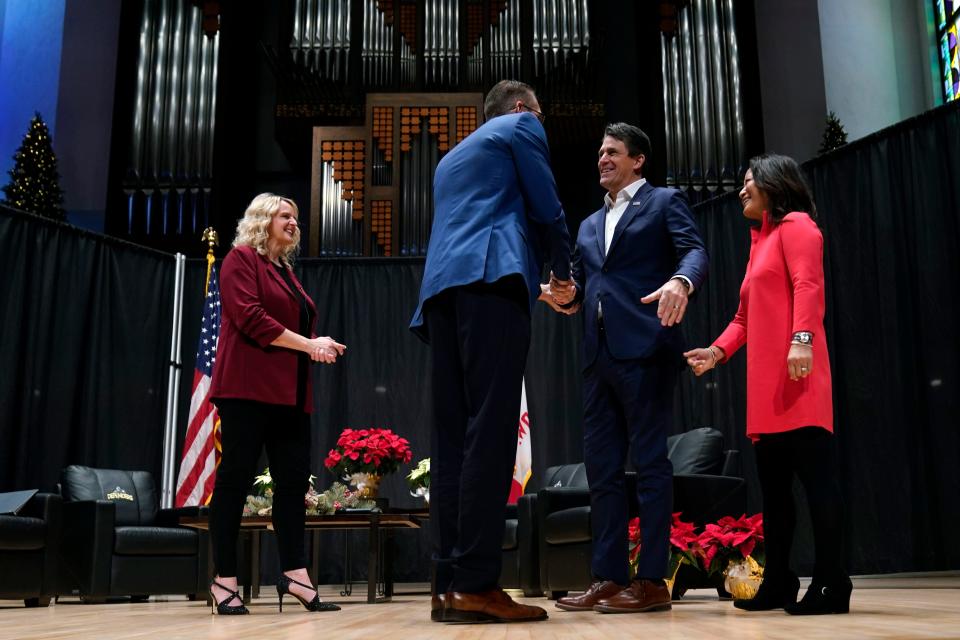 Republican presidential candidate businessman and pastor Ryan Binkley and his wife Ellie, right, greet U.S. Rep. Randy Feenstra, R-Iowa, during Feenstra's Faith and Family with the Feenstras event, Saturday, Dec. 9, 2023, in Sioux Center, Iowa.