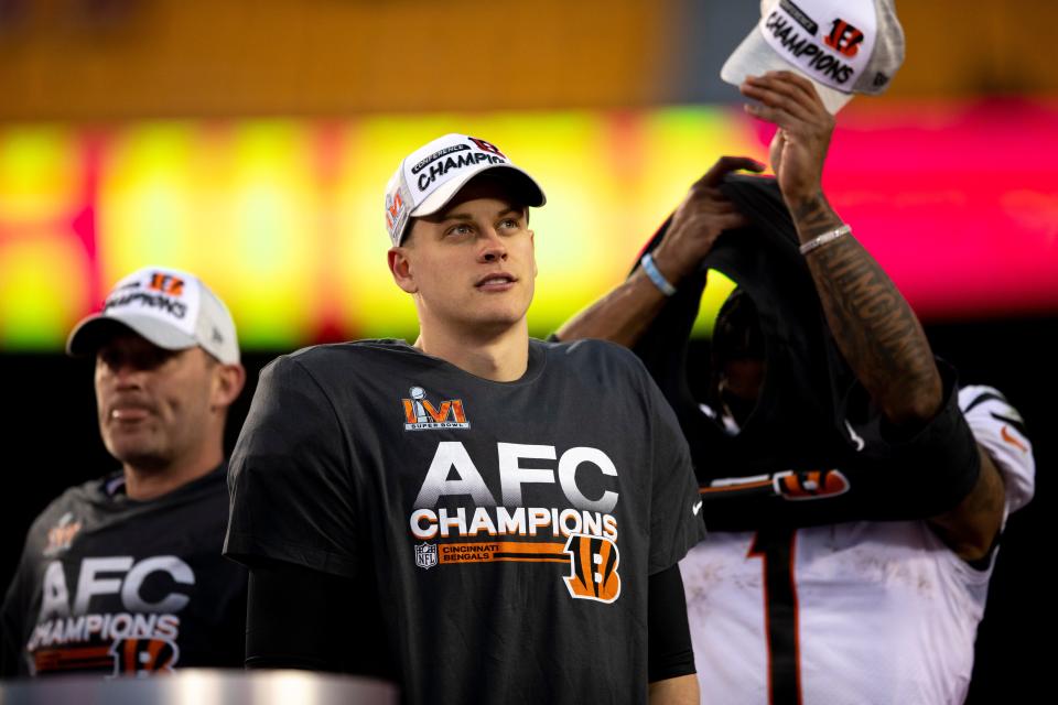 Cincinnati Bengals quarterback Joe Burrow (9) looks on during the AFC Championship trophy celebration after the AFC championship NFL football game, Sunday, Jan. 30, 2022, at GEHA Field at Arrowhead Stadium in Kansas City, Mo. Cincinnati Bengals defeated Kansas City Chiefs 27-24.