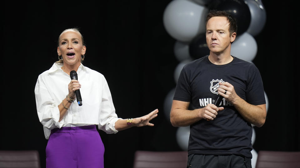 Ashley and Ryan Smith, owners of Utah's new NHL hockey team, speak before players were introduced to fans Wednesday, April 24, 2024, in Salt Lake City. (AP Photo/Rick Bowmer)