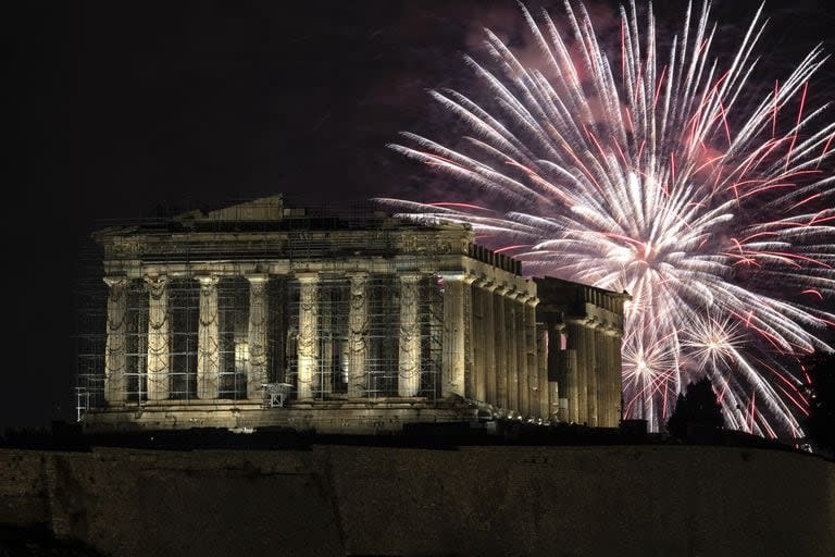 Fireworks explode over the ancient Parthenon temple at the Acropolis hill during New Year's celebrations in Athens, Greece, Monday, Jan. 1, 2024. (AP Photo/Yorgos Karahalis)