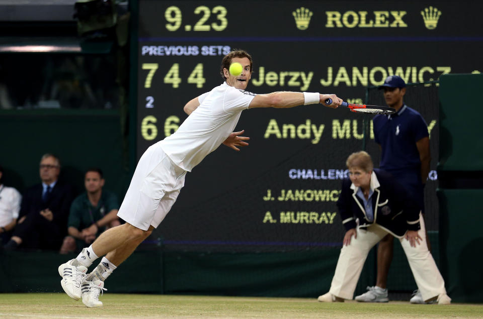 Great Britain's Andy Murray in action against Poland's Jerzy Janowicz during day eleven of the Wimbledon Championships at The All England Lawn Tennis and Croquet Club, Wimbledon.