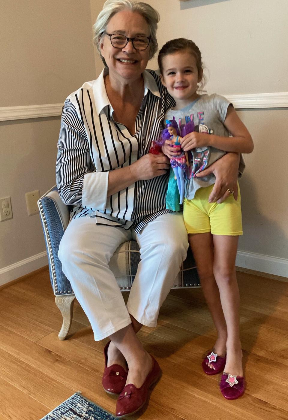 Brenda Mickey, seen here with her granddaughter, returned to her work as a perioperative nurse at Saint Anne's Hospital, after retiring in 2019 to help care for her husband.