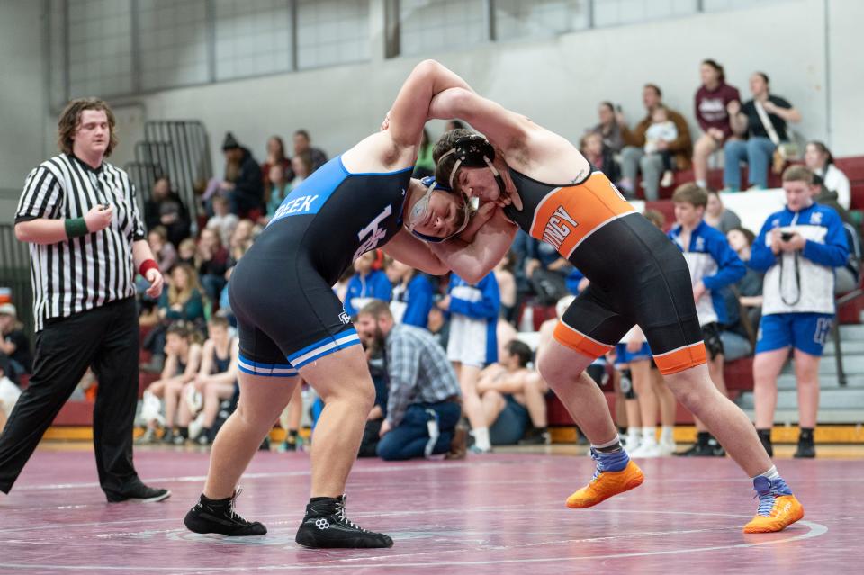 Harper Creek junior Ricky Johnson faces off against Quincy during a meet at Union City High School on Wednesday, Dec. 6, 2023.