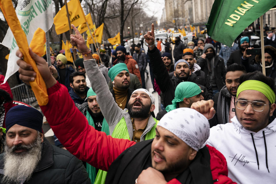 Protesters chant on Fifth Avenue outside the Consulate General of India, Tuesday, Jan. 26, 2021, in the Manhattan borough of New York. Republic Day marks the anniversary of the adoption of India’s constitution on Jan. 26, 1950. (AP Photo/John Minchillo)