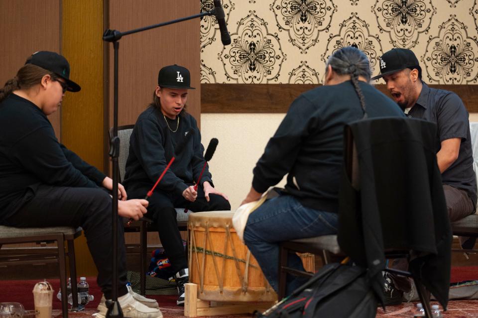 Sharp Feather Drum Group opens revenue sharing ceremonies with a drum song at FireKeepers Casino Hotel on Thursday, March 14, 2024.