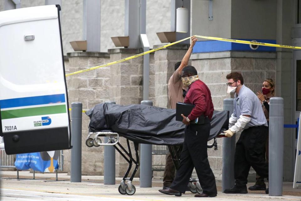 Medical examiners from the Miami-Dade Police Department remove the body of a man who was shot inside a Walmart Supercenter store at 8400 Coral Way, in Miami, Florida, on Saturday, September 26, 2020.