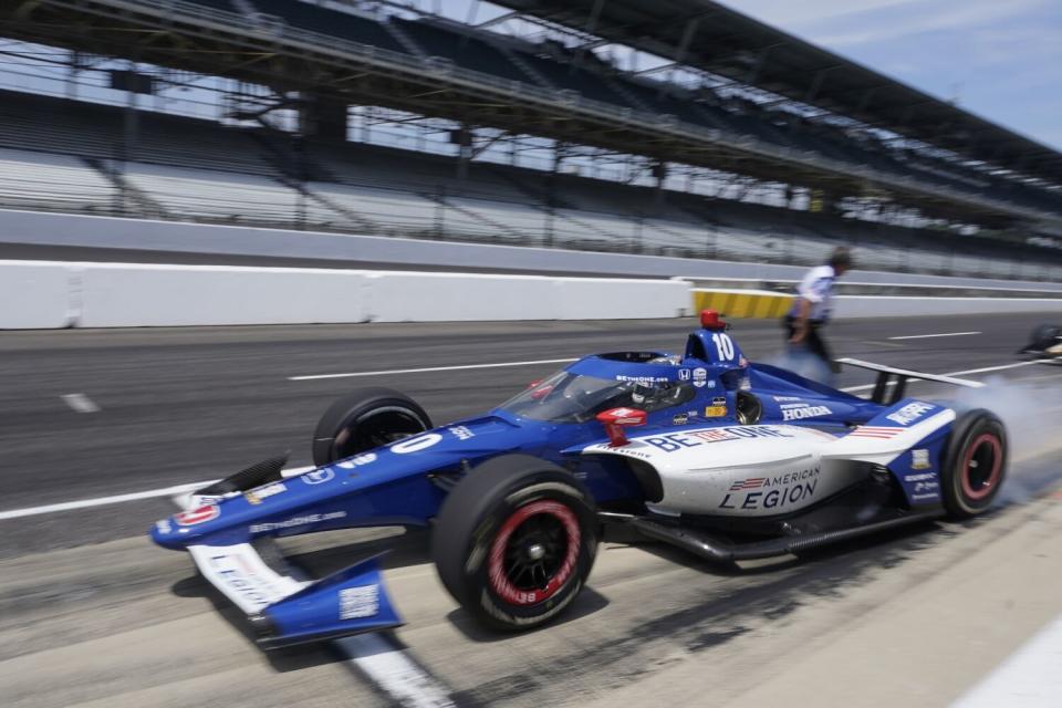 Alex Palou, of Spain, leaves the pits during practice for the Indianapolis 500