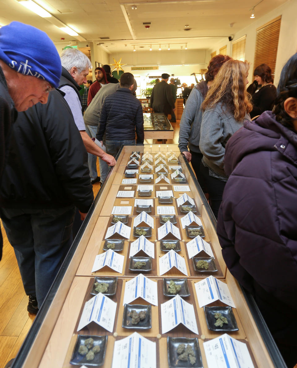 <p>A customer peers at different marijuana strains in a glass case at Harborside, one of California’s largest and oldest dispensaries of medical marijuana, on the first day of legalized recreational marijuana in Oakland, Calif., Jan. 1, 2018. (Photo: Elijah Nouvelage/Reuters) </p>