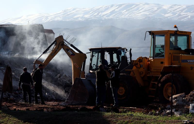 FILE PHOTO: Machineries operate at a site that was hit by a strike, in Saraain