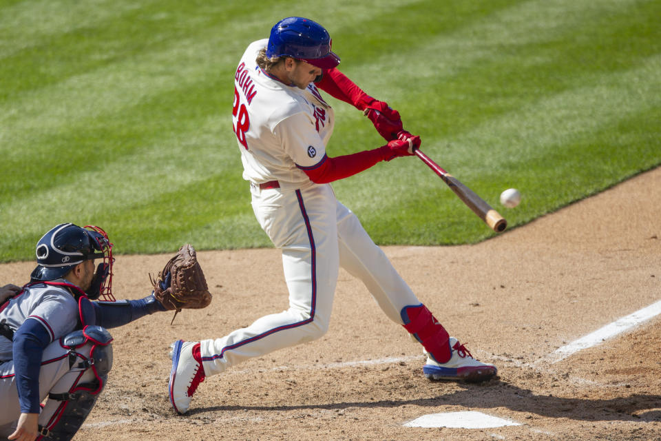 Philadelphia Phillies Alec Bohm (28) hits an RBI single during the eighth inning of a baseball game against the Atlanta Braves, Sunday, April 4, 2021, in Philadelphia. (AP Photo/Laurence Kesterson)