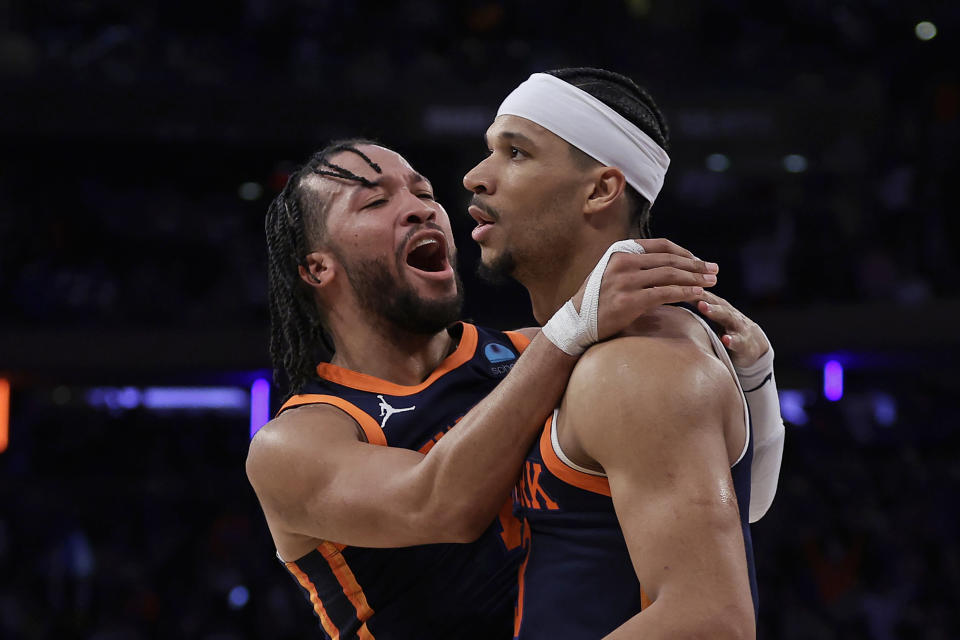 New York Knicks guard Jalen Brunson, left, celebrates with Josh Hart, right, after Hart was fouled by the Detroit Pistons during the second half of an NBA basketball game Monday, Feb. 26, 2024, in New York. (AP Photo/Adam Hunger)