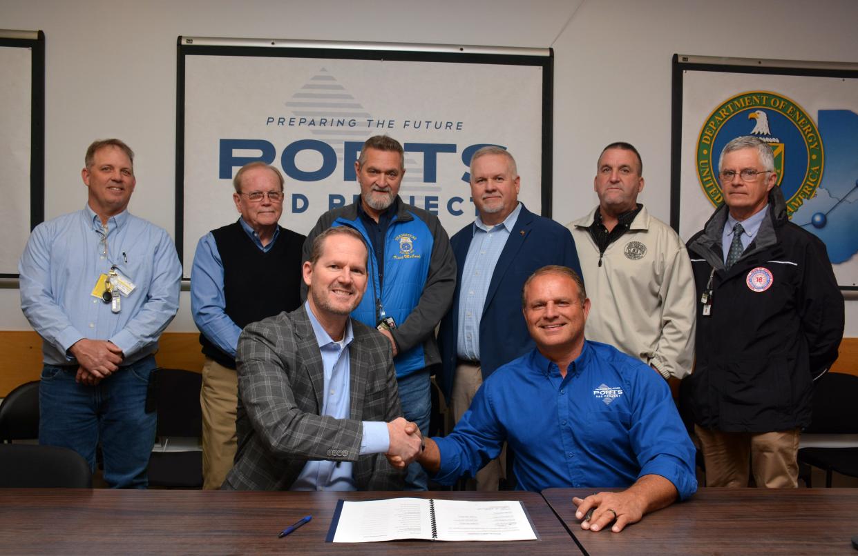 Fluor-BWXT Portsmouth (FBP) and the Tri-State Building and Construction Trades Council recently signed a monumental agreement to utilize personnel for demolition and construction activities at the Portsmouth site. The contract became effective March 7. From left, Jody Crabtree, Ron Lee, Business Manager John Holbrook, Kent McCord, Robert Cole, FBP President and CEO Greg Wilkett, Jim McGraw, and Gerald Baker.