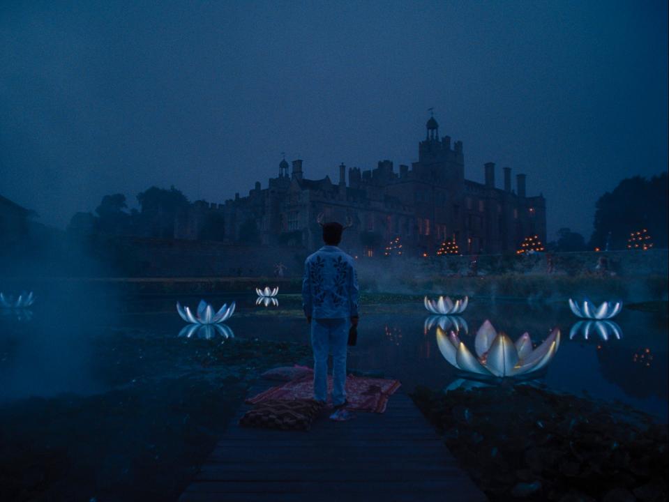 Barry Keoghan standing in front of a building at night