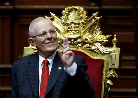 Peru's President-elect Pedro Pablo Kuczynski gestures before receiving the presidential sash during his inauguration ceremony in Lima, Peru, July 28, 2016. REUTERS/Mariana Bazo
