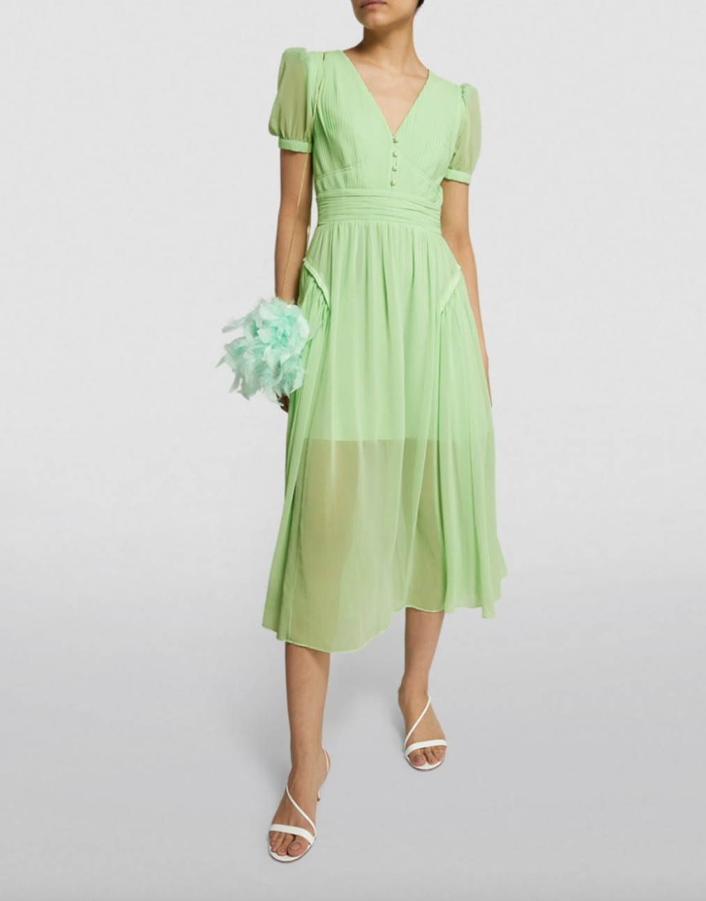 model in light green Self Portrait Chiffon Midi Dress and white heel sandals (Photo via Harrods)