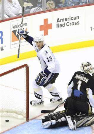 Tampa Bay Lightning's Pavel Kubina (13) celebrates his goal against the Pittsburgh Penguins' goalie Brent Johnson (1) during the third period of Game 5 of their NHL Eastern Conference quarter-final hockey game in Pittsburgh, Pennsylvania, April 23, 2011. REUTERS/David DeNoma