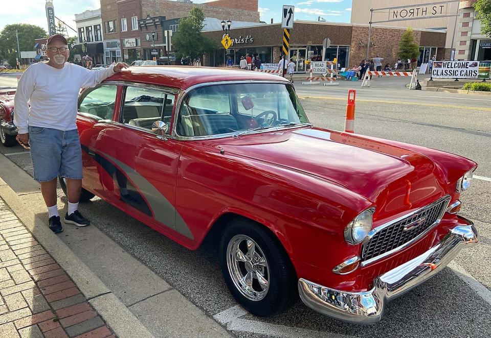 Jim Hudson with his red 1955 Chevy.