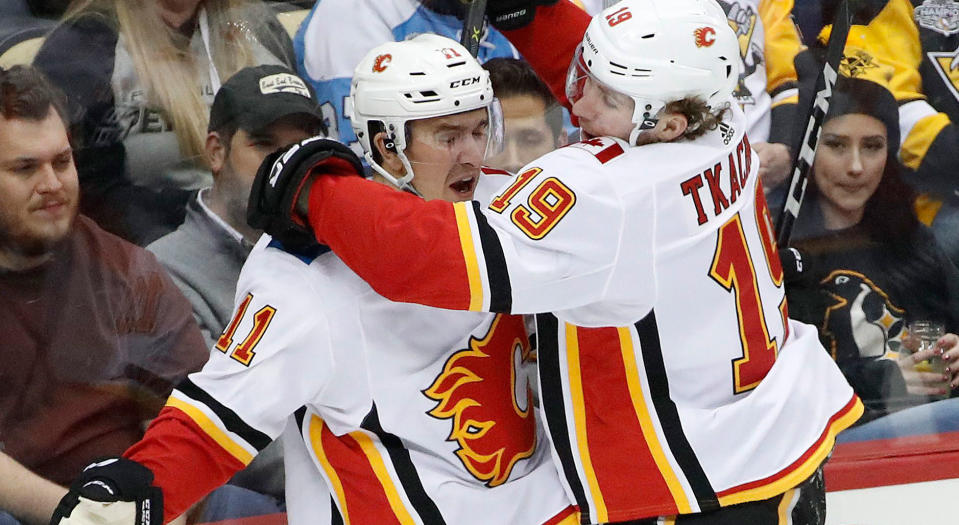 Mikael Backlund celebrates his pretty goal in the first period against the Pittsburgh Penguins (AP Photo/Gene J. Puskar)