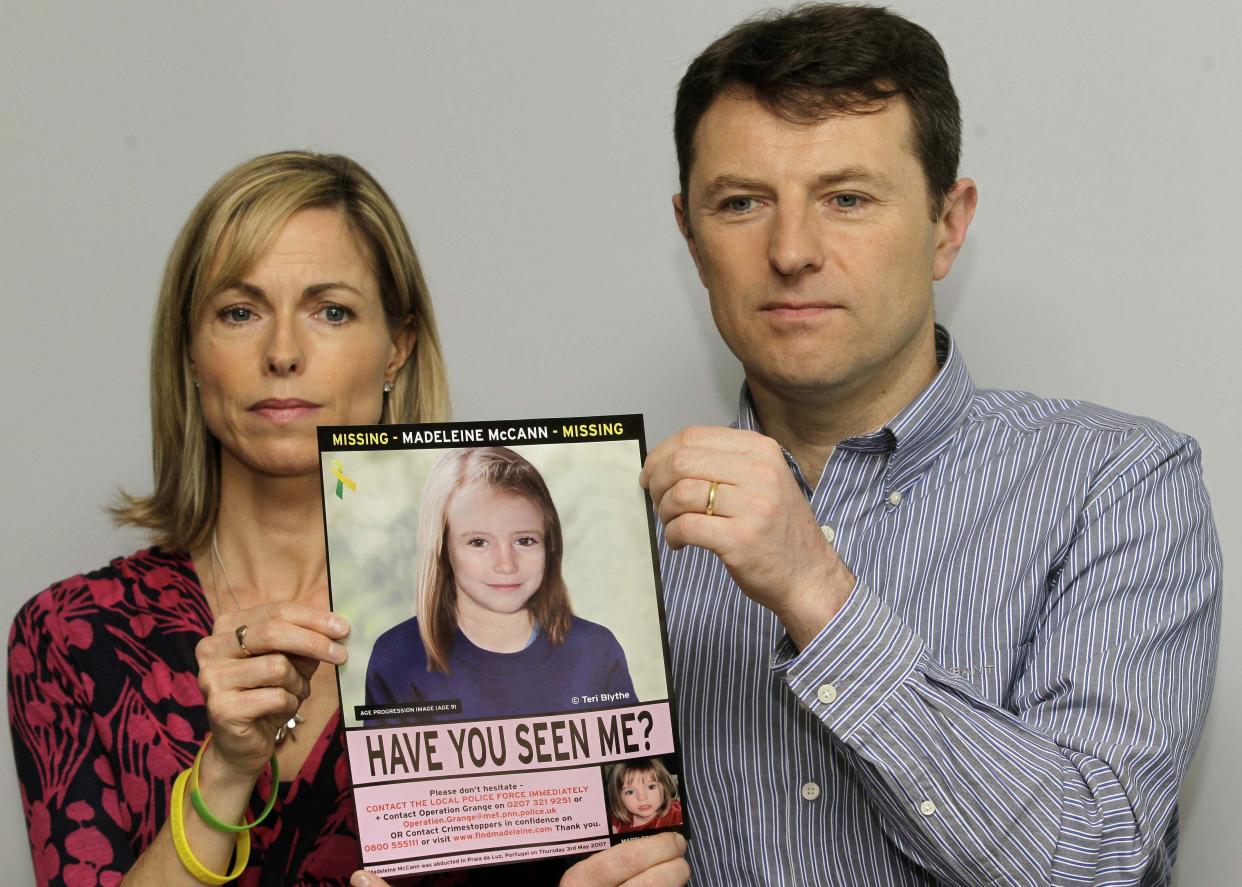 Kate and Gerry McCann pose for the media with a missing poster depicting an age progression computer generated image of their still missing daughter Madeleine during a news conference in London in 2012.