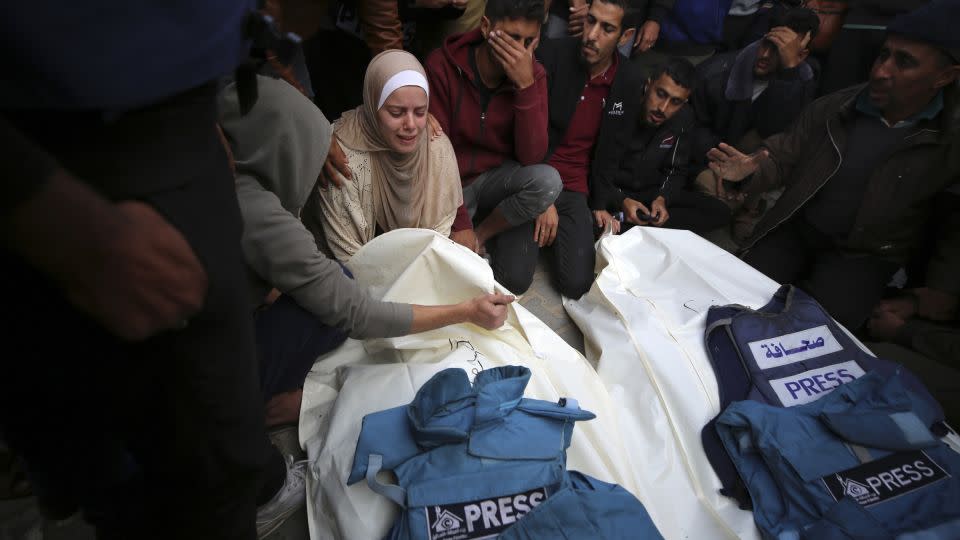 Journalists, relatives and friends pray over the body Journalists Sari Mansour and Hassouna Esleem after they were killed in an Israeli bombardment of Bureij camp in the central Gaza Strip on November 19, 2023. - Majdi Fathi/NurPhoto/Getty Images