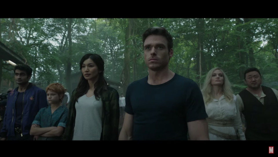 A group shot of Marvel's Eternals standing in the woods.