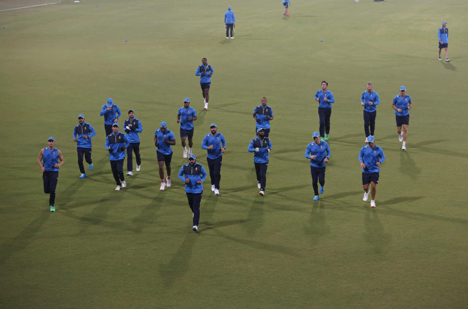 Players of South Africa Twenty20 team warm up during a practice session for the upcoming Twenty20 match against Pakistan, at the Gaddafi Stadium, in Lahore, Pakistan, Tuesday, Feb. 9, 2021. South Africa will play three Twenty20 matches against Pakistan, starting from Feb. 11. (AP Photo/K.M. Chaudary)