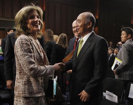 Japan's Ambassador to the United States Kenichiro Sasae (R) meets with Caroline Kennedy, daughter of former U.S. President John F. Kennedy, after a U.S. Senate Foreign Relations Committee hearing on her nomination as the U.S. Ambassador to Japan, on Capitol Hill in Washington, September 19, 2013. REUTERS/Jason Reed