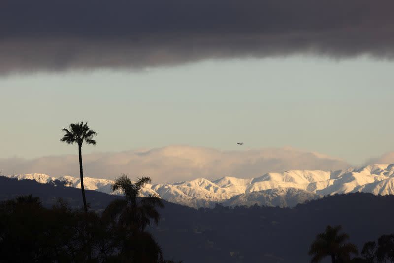 Snow covered mountains surround the city of Los Angeles following winter storm