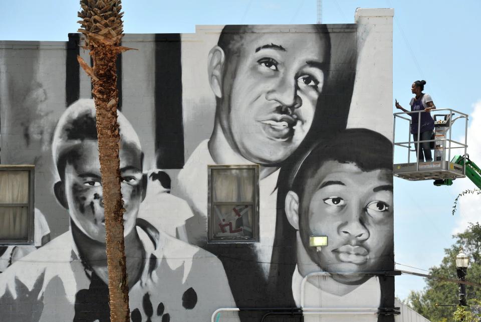 mages of a bloodied Charlie Griffin, Civil Rights Activist and NAACP leader Roy Wilkins and a young Rodney Hurst adorn the North side of the Eastside Brotherhood Club.[Bob Self/Florida Times-Union]