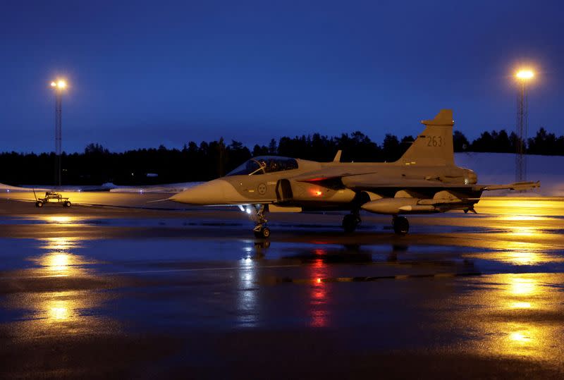 A Swedish JAS Gripen fighter jet rolls on the tarmac at Kallax Air Base