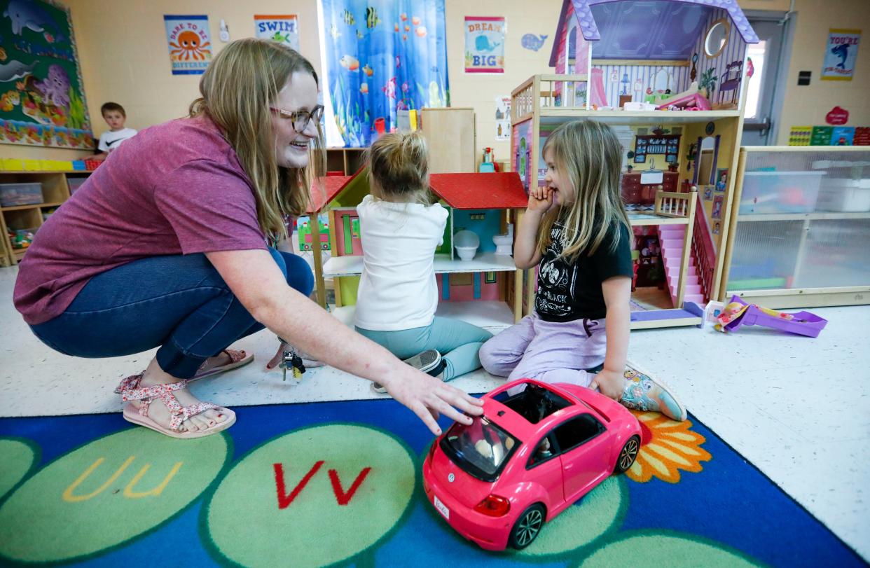 Humansville preschool teacher Savannah Hammond interacts with students Allyson (right) and Whitlee during play time on Wednesday, Nov. 15, 2023.