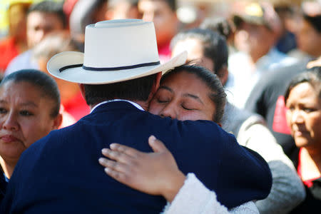 Residents react after a mass for their relative who died during the explosion of a fuel pipeline ruptured by oil thieves, in the municipality of Tlahuelilpan, state of Hidalgo, Mexico January 22, 2019. REUTERS/Mohammed Salem