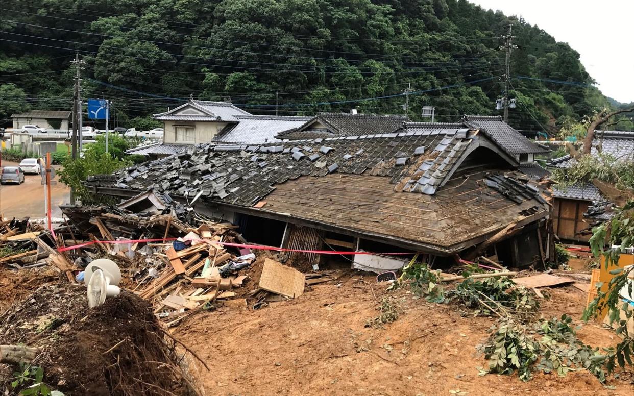 A collapsed house following a landslide caused by torrential rain in Ashikita, Kumamoto prefecture - STR/AFP