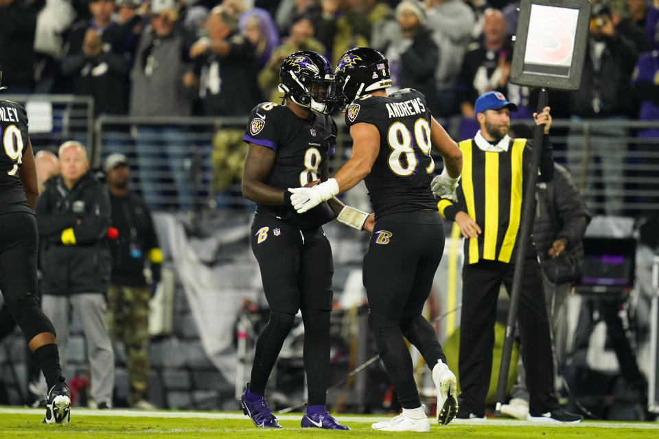 Baltimore Ravens' Mark Andrews (89) and teammate quarterback Lamar Jackson celebrate a touchdown during the first half of an NFL football game against the Cincinnati Bengals, Sunday, Oct. 9, 2022, in Baltimore. (AP Photo/Julio Cortez)