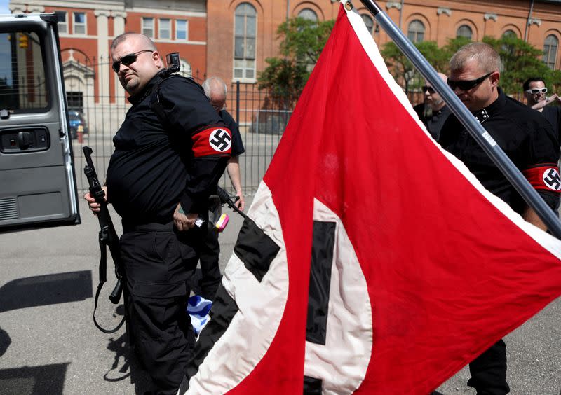 FILE PHOTO: Members of the National Socialist Movement, a white nationalist group, ready their firearms as they prepare to demonstrate against the LGBTQ event Motor City Pride in Detroit, Michigan