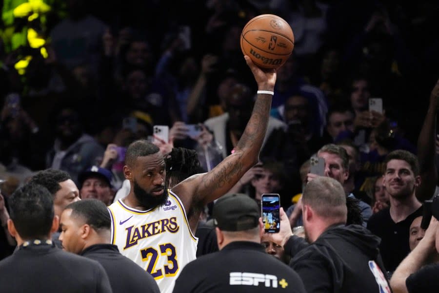 Los Angeles Lakers forward LeBron James acknowledges fans after scoring to become the first NBA player to reach 40,000 points in a career during the first half of an NBA basketball game Saturday, March 2, 2024, in Los Angeles. (AP Photo/Mark J. Terrill)