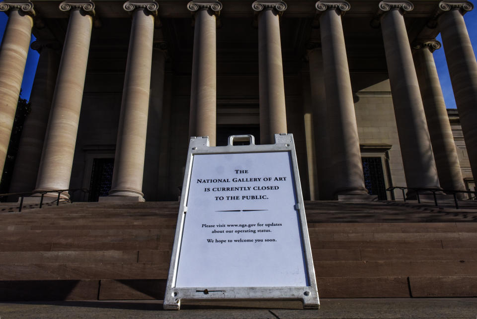 WASHINGTON, DC - March 14:  A sign bearing bad news on the steps of the National Gallery of Art, west building, as Smithsonian Museums, Galleries & the Zoo close to the public due to COVID-19 fears, in Washington, DC. (Photo by Bill O'Leary/The Washington Post via Getty Images)