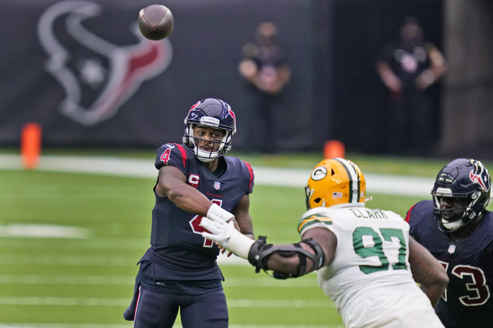 Houston Texans quarterback Deshaun Watson throws over Green Bay Packers defensive tackle Kenny Clark (97) during the second half of an NFL football game Sunday, Oct. 25, 2020, in Houston. (AP Photo/Sam Craft)