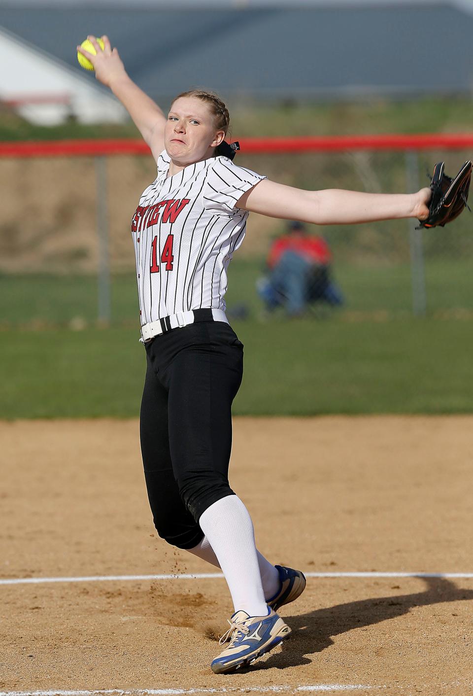 Crestview High School's Chesnie Patton (14) delivers a pitch against Western Reserve High School during high school softball action Tuesday, April 11, 2023. TOM E. PUSKAR/ASHLAND TIMES-GAZETTE