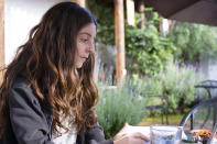 This Aug. 14, 2018 photo provided by Michelle Janikian shows her working at Frontera Cafe in San Cristobal de Las Casas, Mexico. Janikian, who writes about marijuana for publications like Herb, Playboy and Rolling Stone, says after she tells someone what she does for a living she usually spends the rest of the conversation "trying to act so friendly and mainstream” so they don’t think she’s stoned. (Martin Clarke/Michelle Janikian via AP)