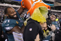 Philadelphia Eagles head coach Nick Sirianni, center, is doused by defensive tackle Fletcher Cox (91) and teammates during the second half of the NFC Championship NFL football game between the Philadelphia Eagles and the San Francisco 49ers on Sunday, Jan. 29, 2023, in Philadelphia. (AP Photo/Matt Slocum)