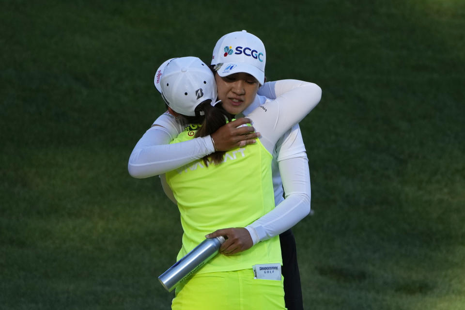 Pajaree Anannarukarn, right, embraces Ayaka Furue after Anannarukarn won the final round of the LPGA Bank of Hope Match Play golf tournament Sunday, May 28, 2023, in North Las Vegas, Nev. (AP Photo/John Locher)