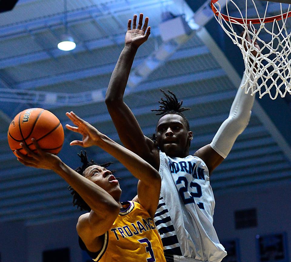 Dorman hosted Northwestern in the second round of the boys high school basketball playoffs at Dorman High School on Feb. 18, 2022.  Northwestern Omari Bryson (3) works under the basket as Dorman Jordyn Surratt (22) tries to stop him. 