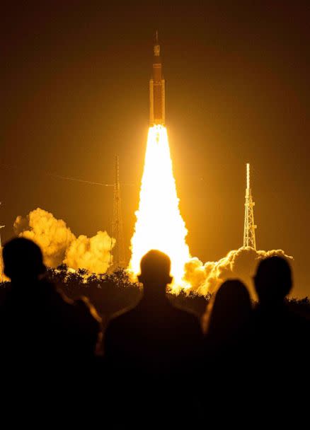 PHOTO: Spectators watch as the Artemis I unmanned lunar rocket lifts off from launch pad 39B at NASA's Kennedy Space Center in Cape Canaveral, Florida, on Nov. 16, 2022. (Jim Watson/AFP via Getty Images)