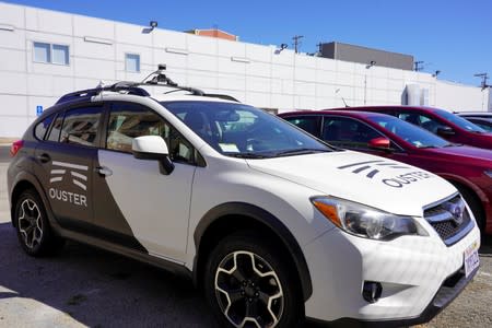 A car outfitted with Ouster's lidar, used in scanning the area on a self-driving vehicle, is parked at the technology company's office in San Francisco