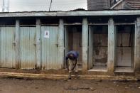 <p>A public toilet in the slum of Kibera, Nairobi. (Photo: Simon Maina/AFP/Getty Images) </p>