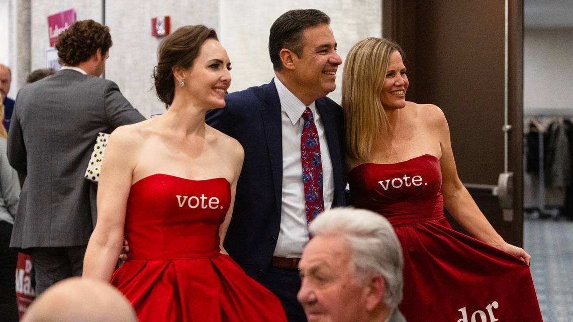 Sara Brady, left, and Kirsten Lucas, right, pose for a photograph with Idaho attorney general elect Raúl Labrador on election night in Boise on Nov. 8, 2022.