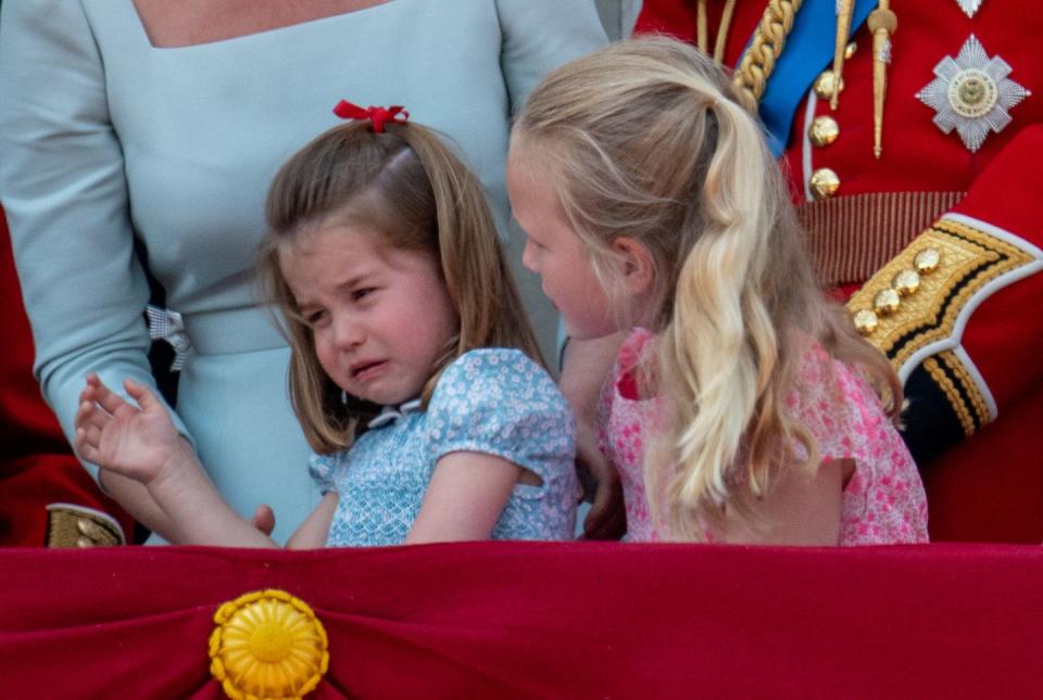 <p>But then, the unthinkable happens ... <a rel="nofollow noopener" href="https://www.goodhousekeeping.com/life/a21245786/princess-charlotte-fall-trooping-the-colour-2018/" target="_blank" data-ylk="slk:Princess Charlotte trips;elm:context_link;itc:0;sec:content-canvas" class="link ">Princess Charlotte trips</a>! Savannah tries to comfort her tiny cousin, but is unsuccessful. </p>