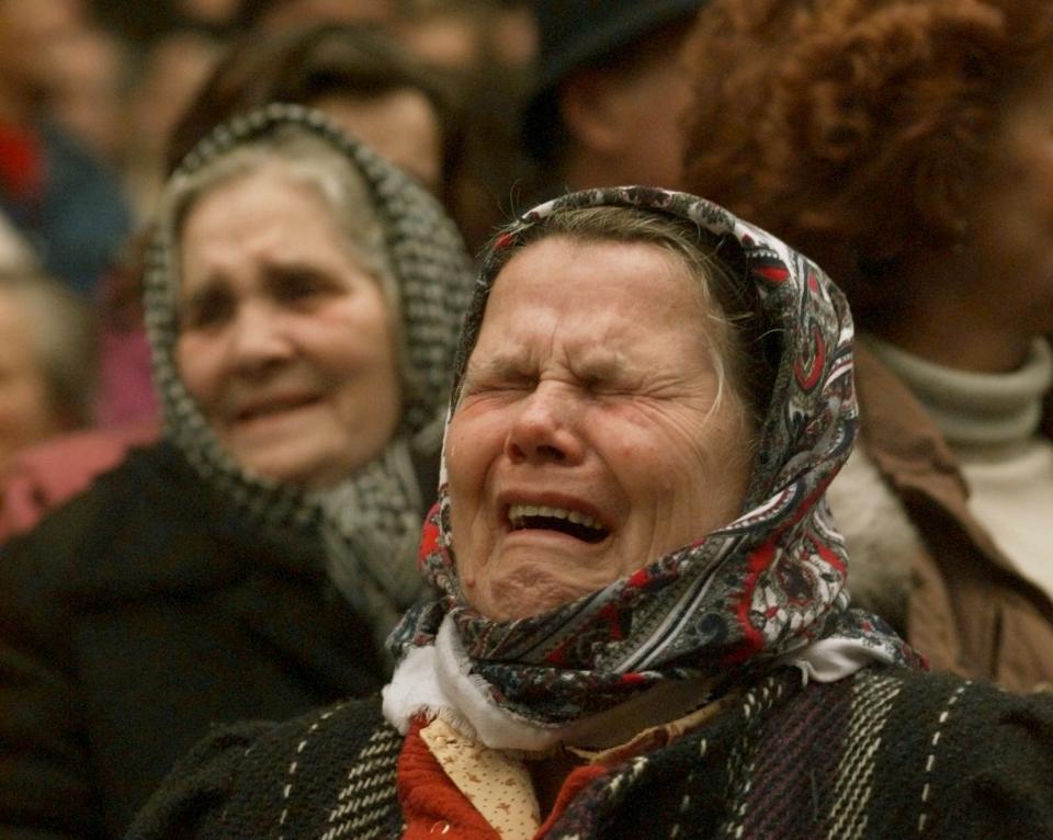 FILE - Bosnian Muslim women weep during a downtown Sarajevo rally calling for unity with their former neighbors in the Serb held neighborhood of Grbavica, on Dec. 11, 1995. Former award-winning Associated Press photographer John Gaps III, who documented everything from war zones to the NCAA College World Series during his career, was found dead at his home Monday, Oct. 17, 2022, in Des Moines, Iowa, his family confirmed Tuesday. He was 63. (AP Photo/John Gaps III, File)