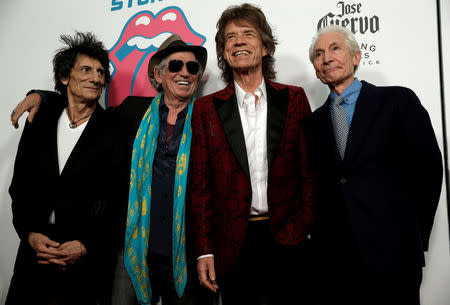 FILE PHOTO: The Rolling Stones (from L-R) Ronnie Wood, Keith Richards, Mick Jagger and Charlie Watts pose as they arrive for the opening of the new exhibit "Exhibitionism: The Rolling Stones" in the Manhattan borough of New York City, U.S., November 15, 2016. REUTERS/Mike Segar/File Photo